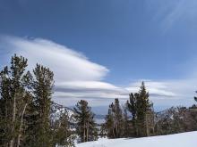 Lenticular clouds indicating increased winds.