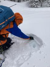 About 6 inches of new snow on top of a thin melt freeze crust with a deep layer of wet snow below it. 