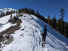 The ridgeline showed signs of wind scouring on both sides of the ridge.