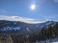 Lenticular clouds and wind indicating the approaching storm.