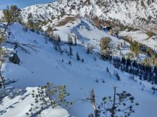 View of top skiers right side of avalanche start zone, partially covered up by additional snowfall.