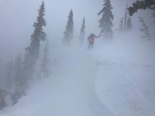 Poor visibility with blowing snow on summit ridge above 9200'