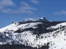Pluming snow over Castle Peak