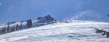 E winds blowing snow across the Silver Peak ridgeline.