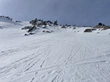 Natural dry loose snow off of rocks overhead.