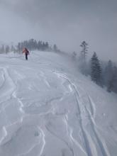 Blowing and drifting snow depositing onto N aspect terrain.