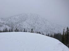 Low cloud ceiling throughout most of the day with light snow.