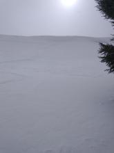 Only a 1 inch thick wind slab below this cornice area with no results on a test slope ski cut.