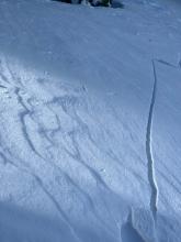 Cracking above a ski track in below tree line terrain. 