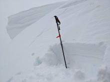 About a foot of wet snow exited below the surface. 