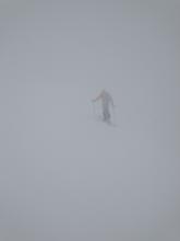 Stormy and wet on the summit ridge of Hidden Peak.