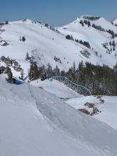 Additional wind slab/wet slab avalanches viewed in the distance looking down into Upper Pole Creek.