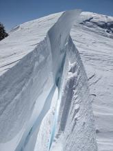 A large crack existed between the remaining cornice pieces and the ridgeline. 