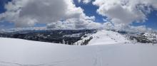 Cloud cover building over the mountains around noon. 