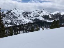 View into Pole Creek with mostly cloudy skies by midday.   