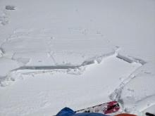A cornice piece dropped on this sunny SE-facing slope produced a small wind-slab failure mixed with a sluff of wet snow. 