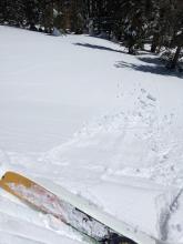 These cornice pieces caused a small sluff of wet snow on the slope below. 