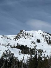 Looking up at Flagpole Peak. There is a several hundred foot long wet slide off the rock buttress to the left of Flagpole Peak that appeared to have happened yesterday.