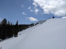 Large cornices still exist along Lincoln Ridge. Debris from old cornice collapses is visible on the slope below.