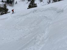 Loose wet and roller balls on a steep E aspect wind loaded feature.