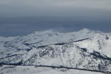 Snow blowing of the Crystal Range Peaks.