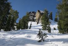 Still some snow lingering on dark rocks on East aspects