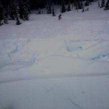 Skier weighted cornice collapse over view.