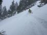 Crossing couloir with slide below skier