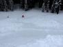 Skier with deployed airbag after being carried 200 vertical feet by small avalanche, no burial.