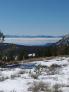 Warm day at elevation with robust inversion clouds still holding over Lake Tahoe at midday.